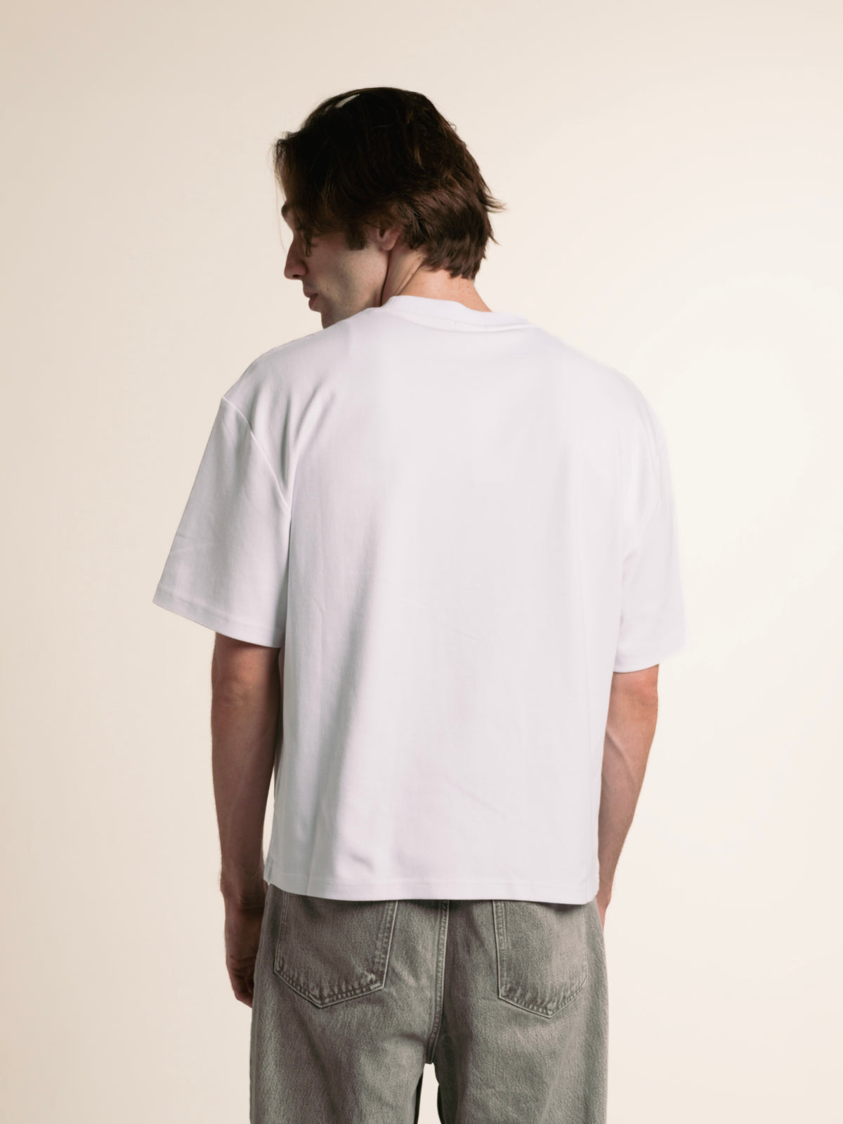 Back view of the white ORY Origin T-Shirt showing its boxy fit