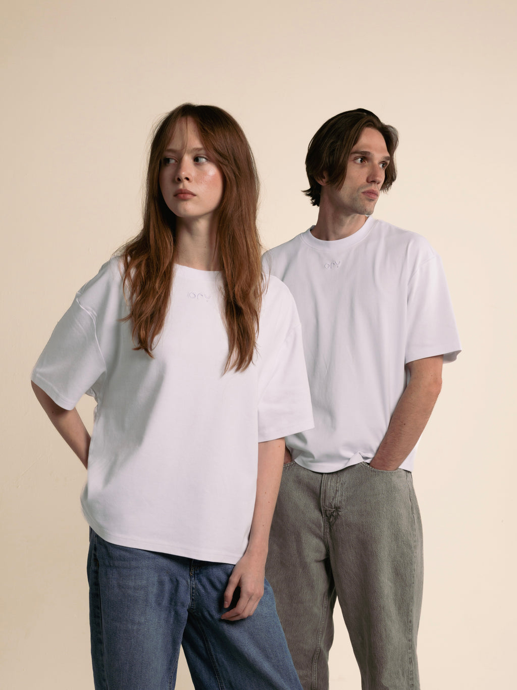 Woman and man in matching white ORY Origin T-Shirts