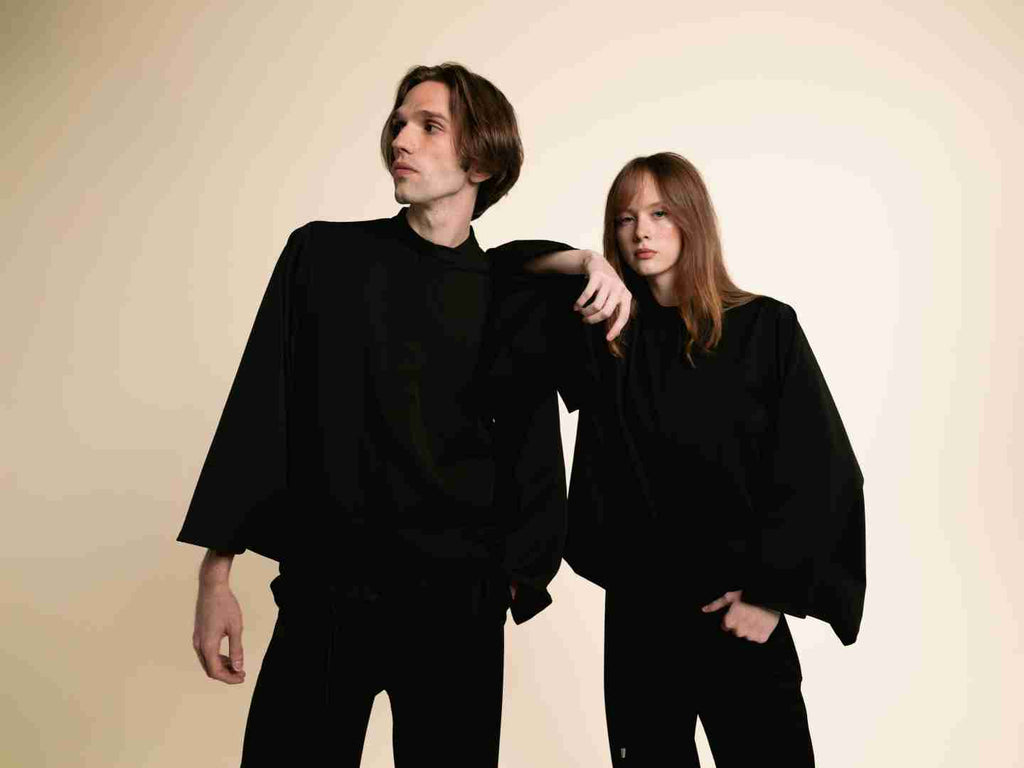 Man and woman wearing the black ORY Kimo Shirt, a kimono-inspired button-down