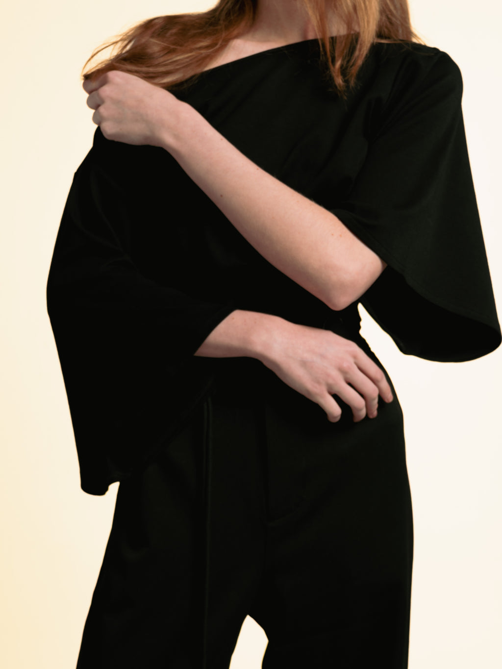 Wide kimono-inspired sleeve detail on the black ORY Kimo Off-Shoulder Top
