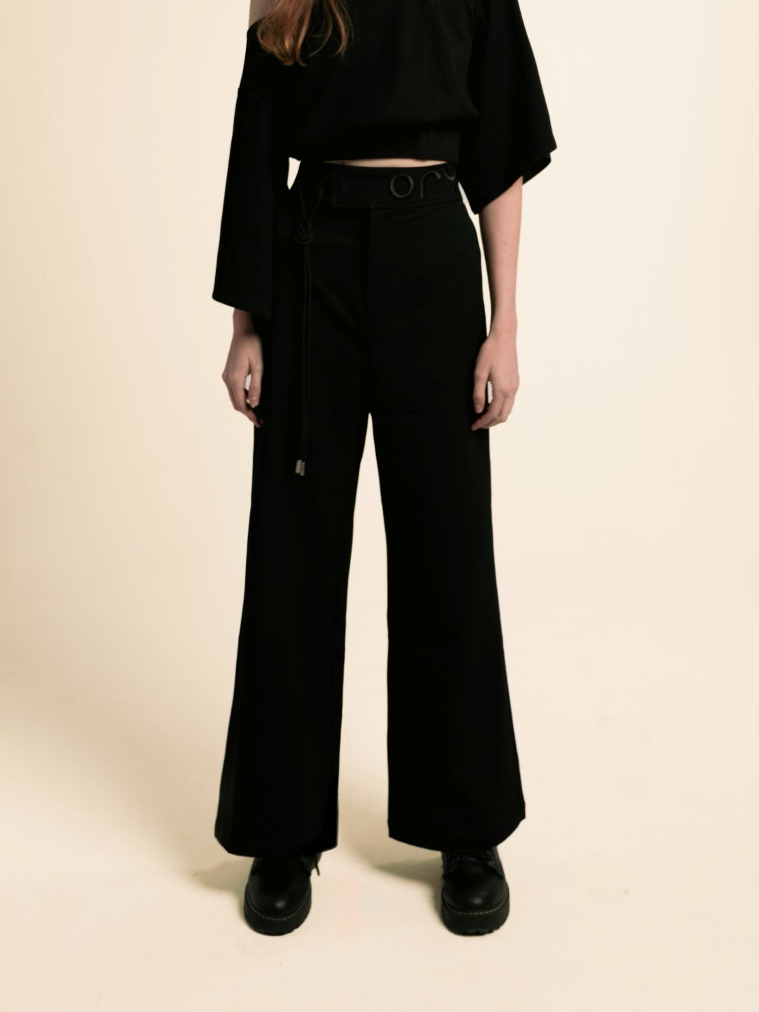 Black ORY Origin wide-leg trousers on a female model, front view